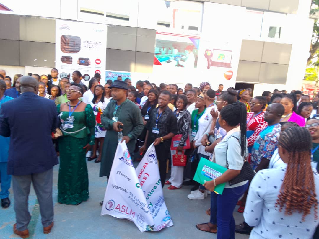 Delegates with ASLM collaboration banner, National Scientific Conference 2024, Douala