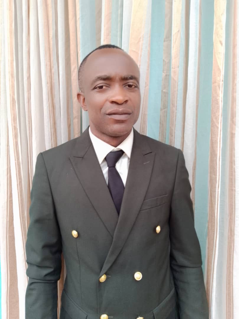 Rev. TAH Ferdinand NDUM, President
